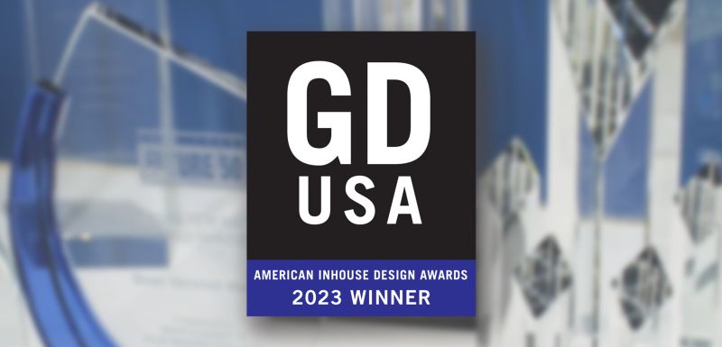 2023 GDUSA Inhouse Design Award plaque, trophies blurred behind.