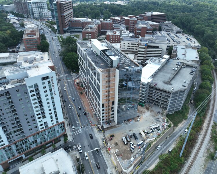 Aerial view of a multi-story building under construction.