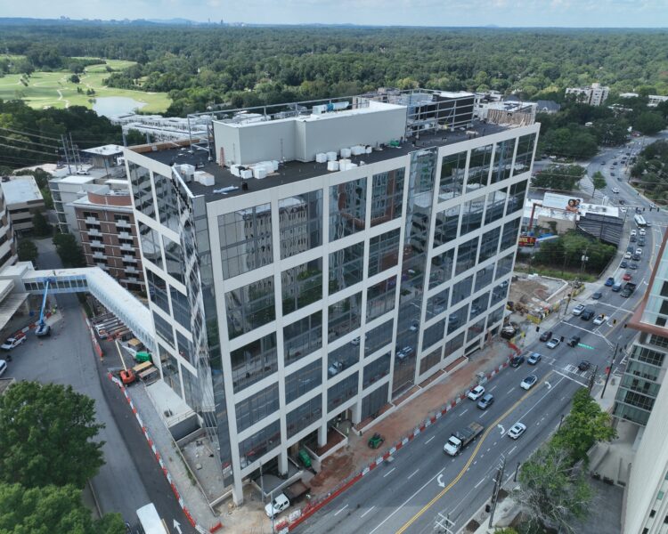 Aerial view of a mid-rise office building under construction.